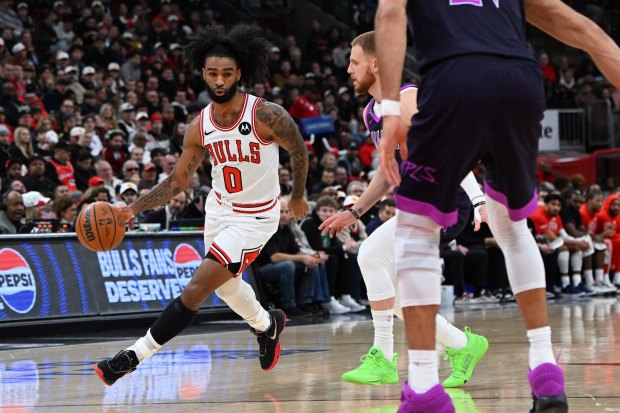 Chicago Bulls' Coby White (0) drives during the first half of an NBA basketball game against the Minnesota Timberwolves, Monday, Dec. 29, 2025, in Chicago. (AP Photo/Paul Beaty)