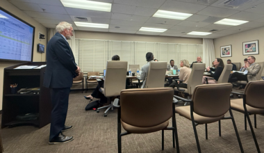 Duval Schools CFO Ron Fagan, left, gives a presentation to school board members about the district's finances on Dec. 8, 2025.