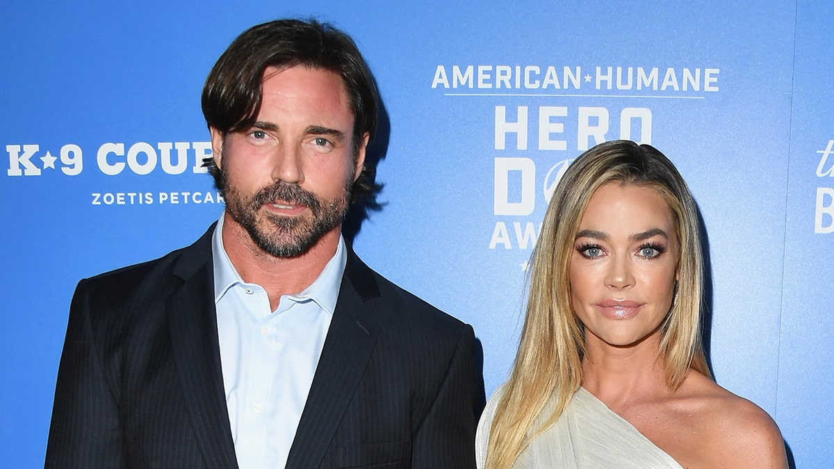 Denise Richards and Aaron Phypers on a red carpet