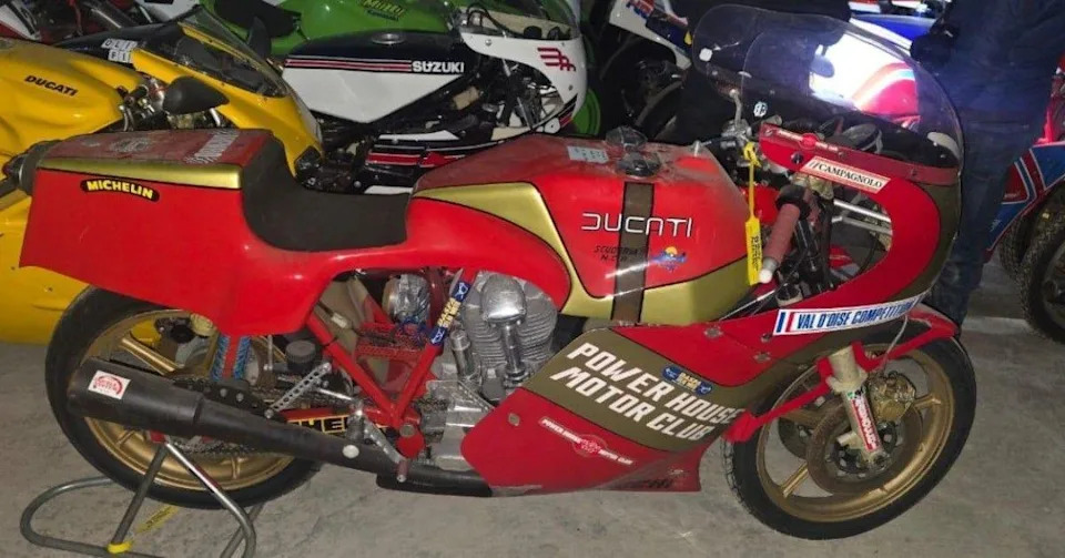 A motorcycle. Its red and says Ducati