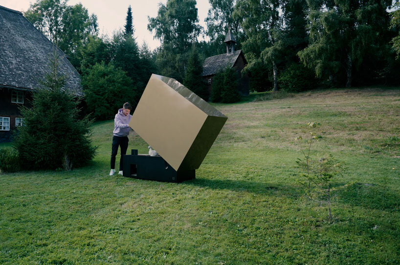 reflective gold facade wraps minimal geometric chicken coop for six fowls