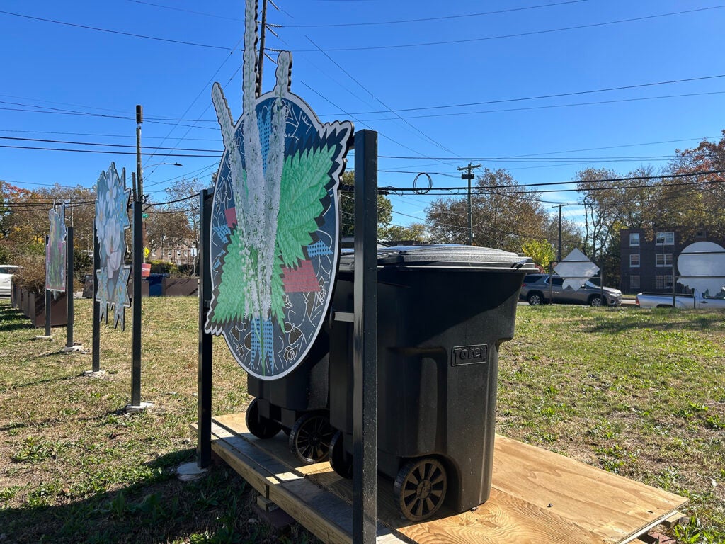 Two large trash cans at Empowered CDC's first community waste disposal site on Elmwood Avenue in Southwest Philadelphia