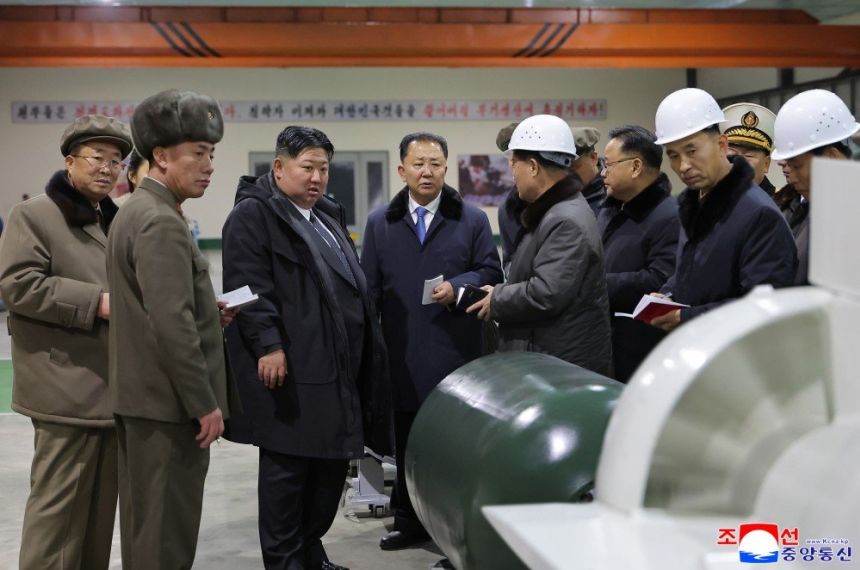 North Korea's leader Kim Jong Un is briefed on the construction of the country's first nuclear-powered submarine.