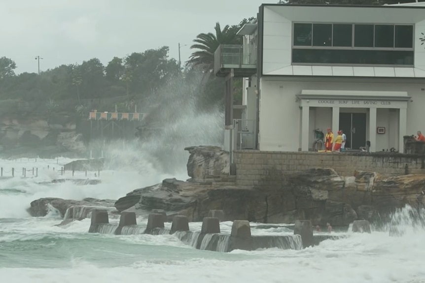 Waves crashing on rocks at Coogee Beach.
