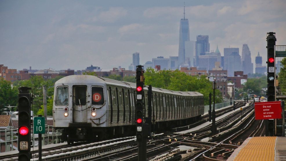 A subway approaches an above ground station in the Brooklyn borough of New York with the New York City skyline in the background, June 21, 2017. (AP Photo/Bebeto Matthews, File)
