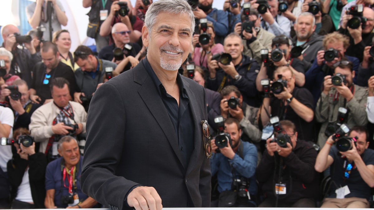 Actor George Clooney poses for photographers during a photo call for the film Money Monster at the 69th international film festival, Cannes, southern France, Thursday, May 12, 2016. (AP Photo/Thibault Camus)