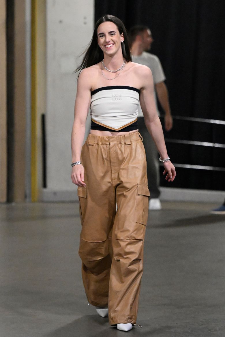 Caitlin Clark of the Indiana Fever arrives at the arena during WNBA All-Star weekend, wearing a Miu Miu bandana top.