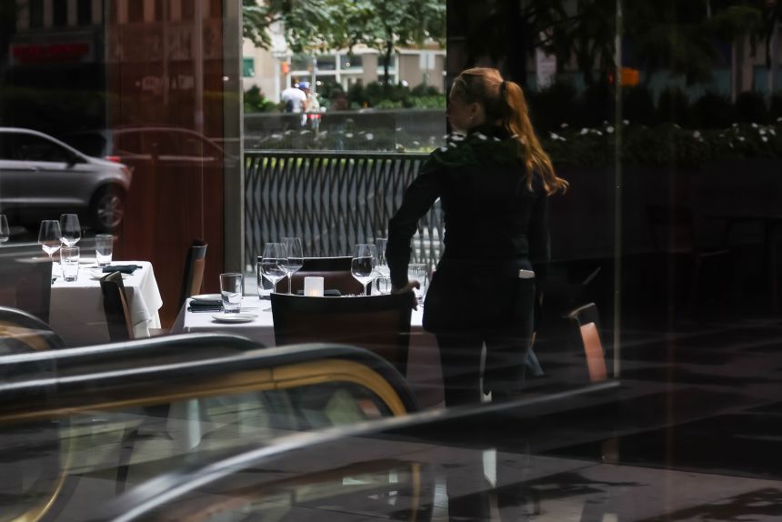 A server in a New York restaurant on September 6.