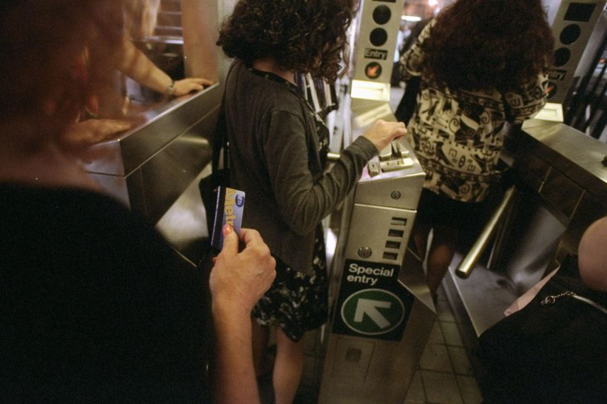 Riders take advantage of MetroCard transfers as they enter subway system near Staten Island Ferry terminal at Whitehall Street on July 7, 1997.