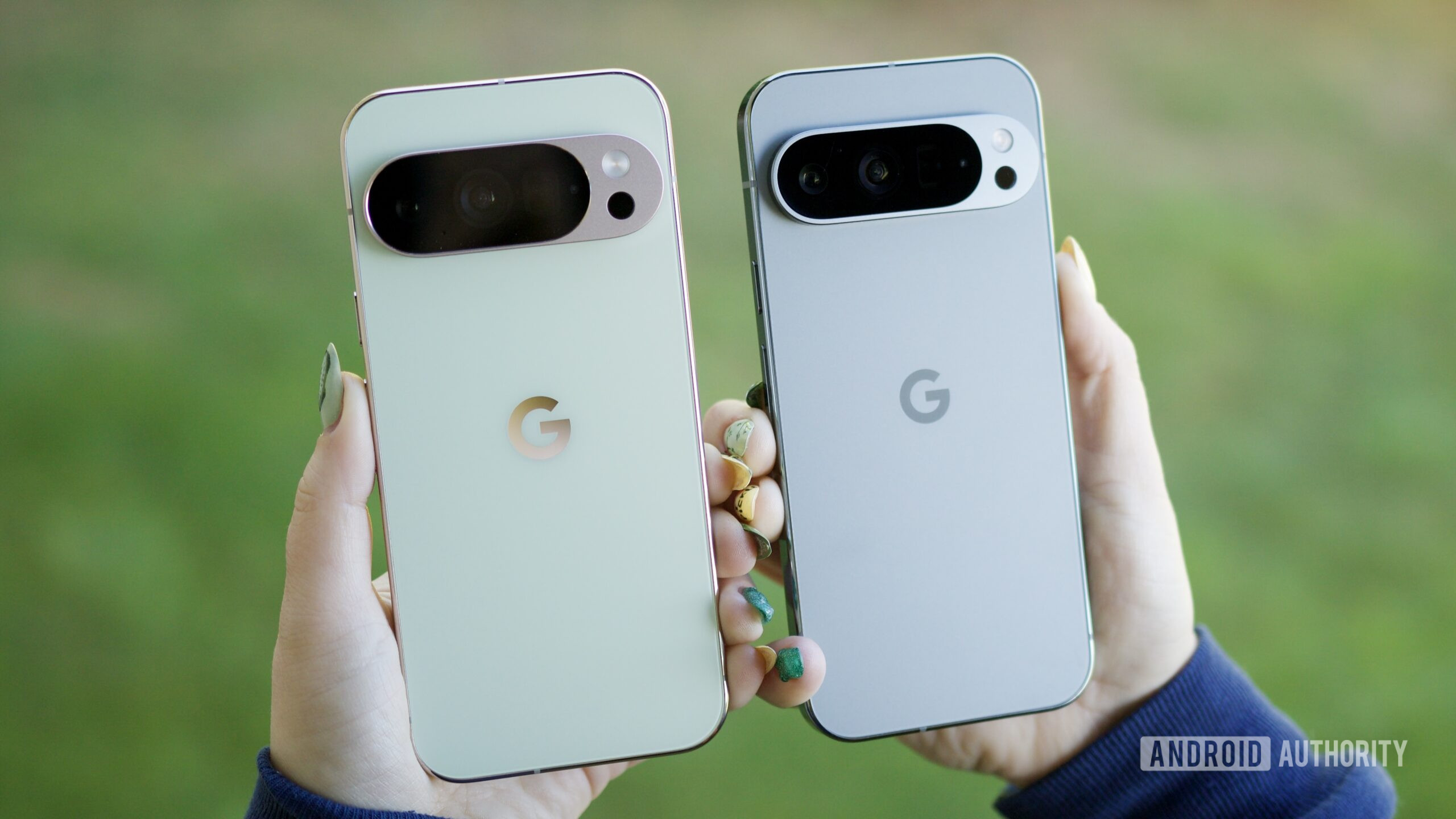 Someone holding the Pixel 10 Pro and Pixel 9 Pro, showing the backs of the phones.