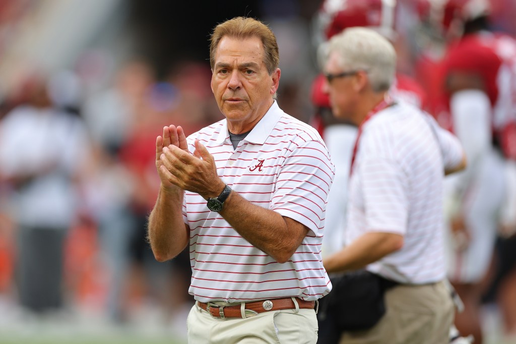 Alabama head coach Nick Saban claps on the sidelines.