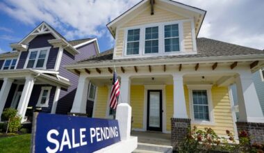 A home is seen with a 'for sale' sign. (File/Spectrum News) (AP File Photo/Michael Conroy)