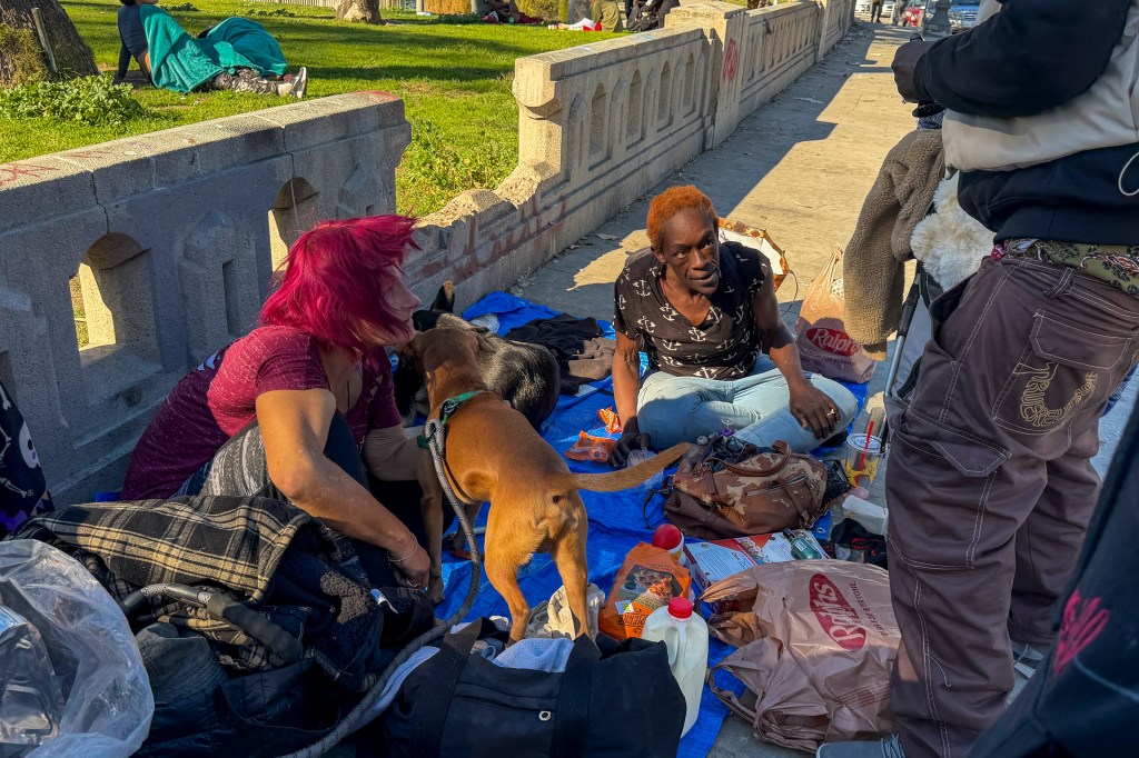 Homeless people resting at MacArthur Park in Los Angeles, California.