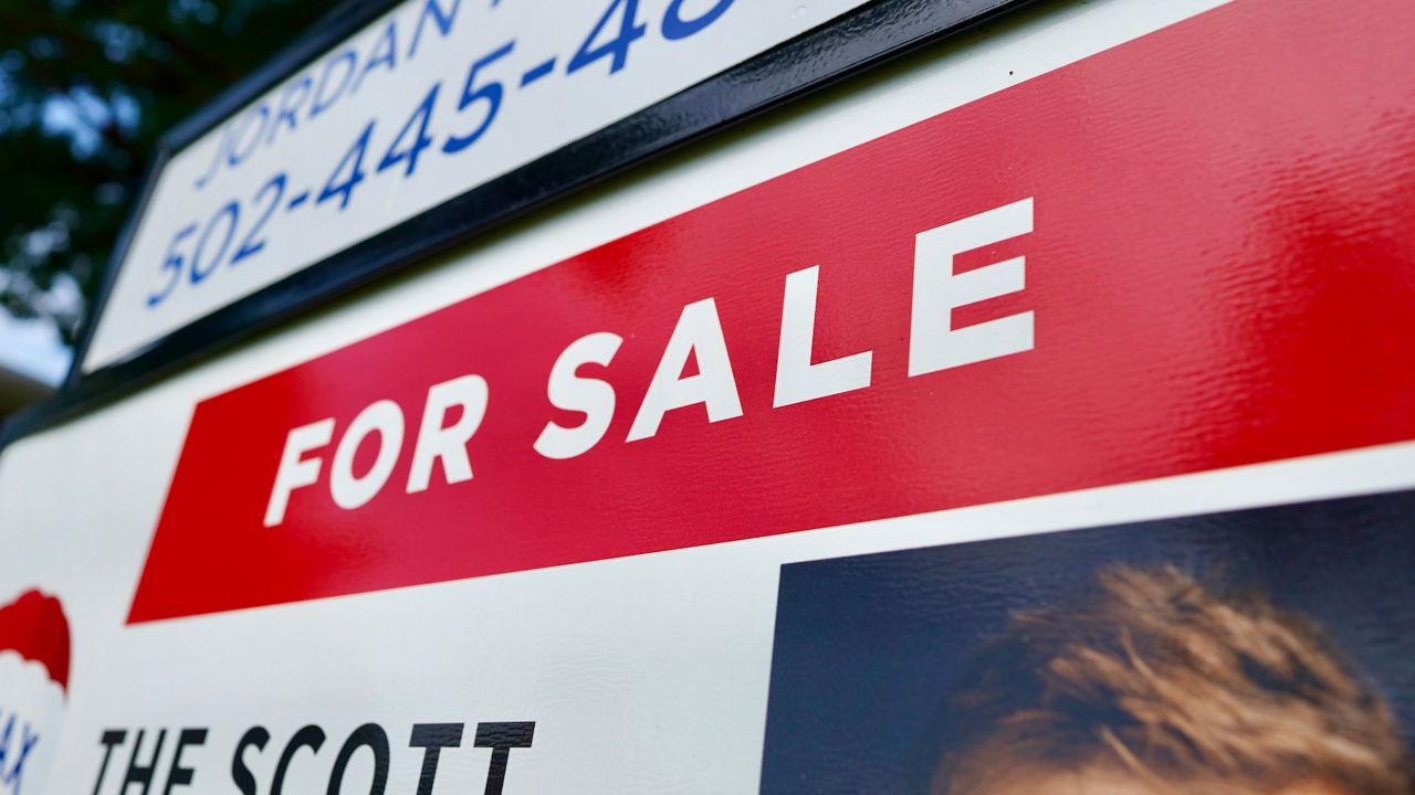 A home for sale sign. (Spectrum News 1/Jonathon Gregg)