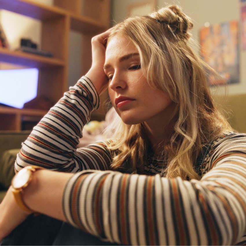 Woman battling chronic stress at home.