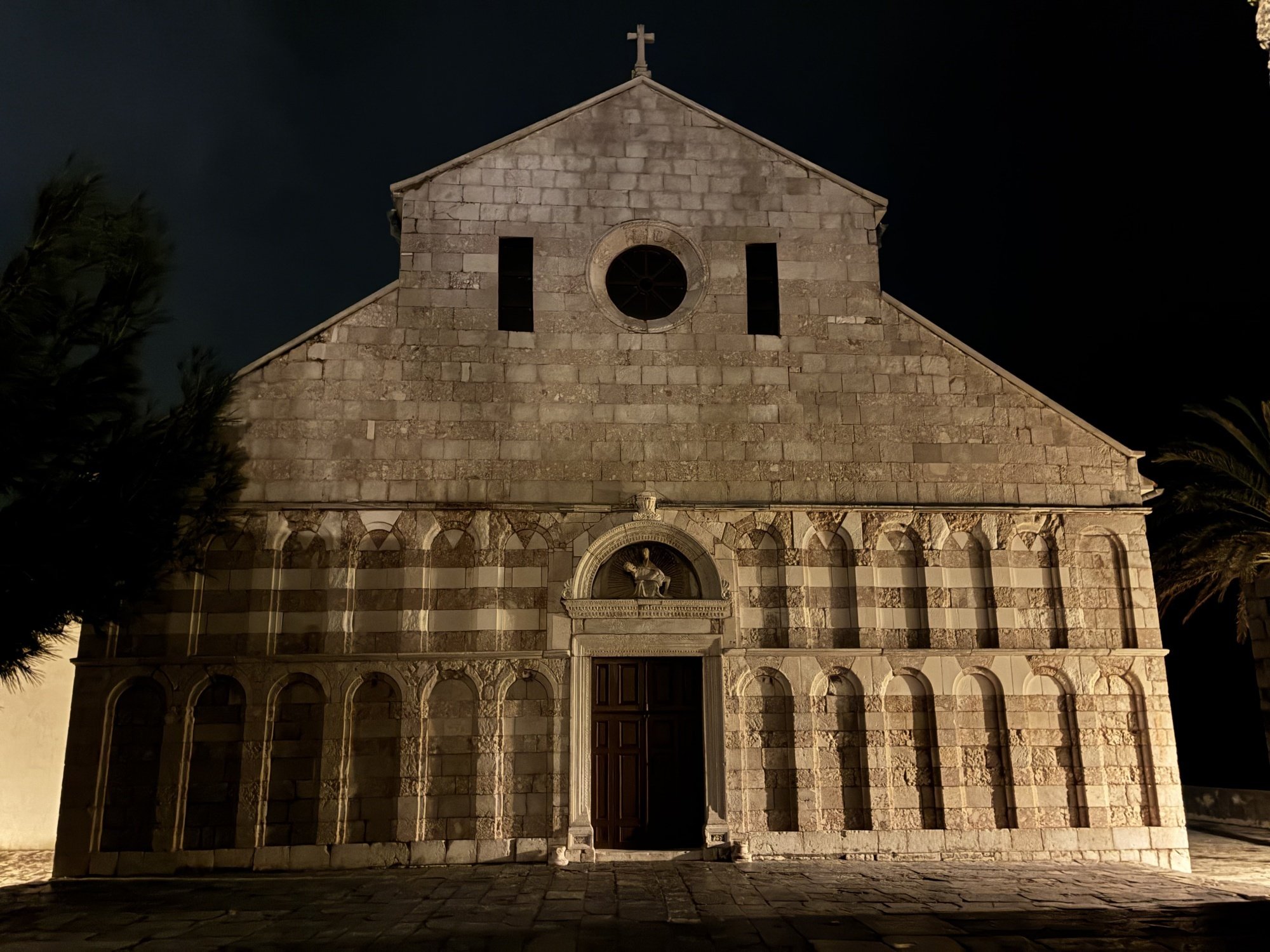 A church photographed at night by an iPhone 16e