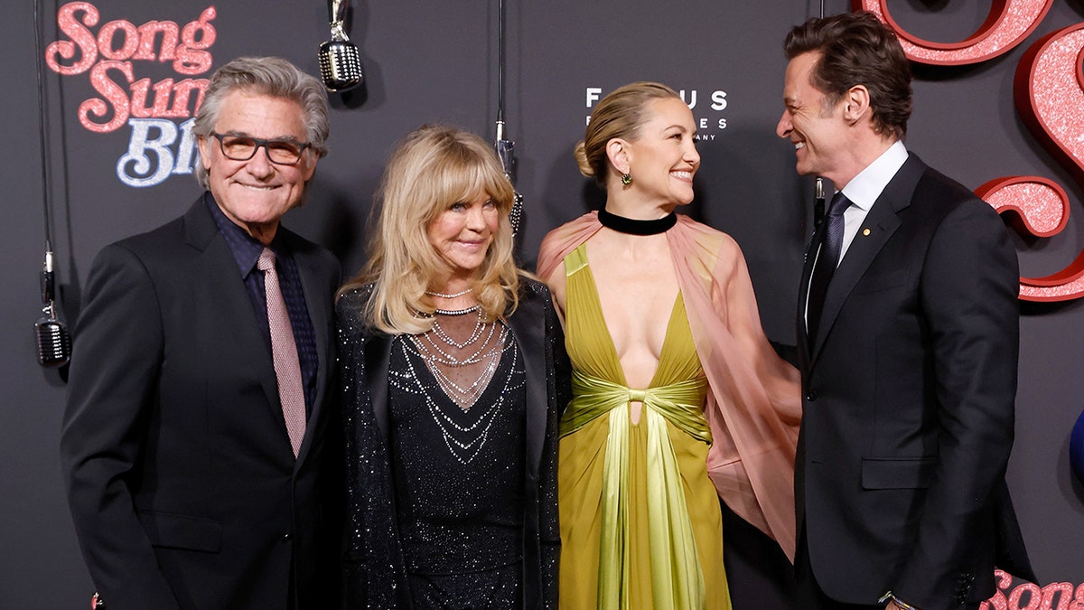 Kate Hudson pictured with Kurt Russell, Goldie Hawn and Hugh Jackman