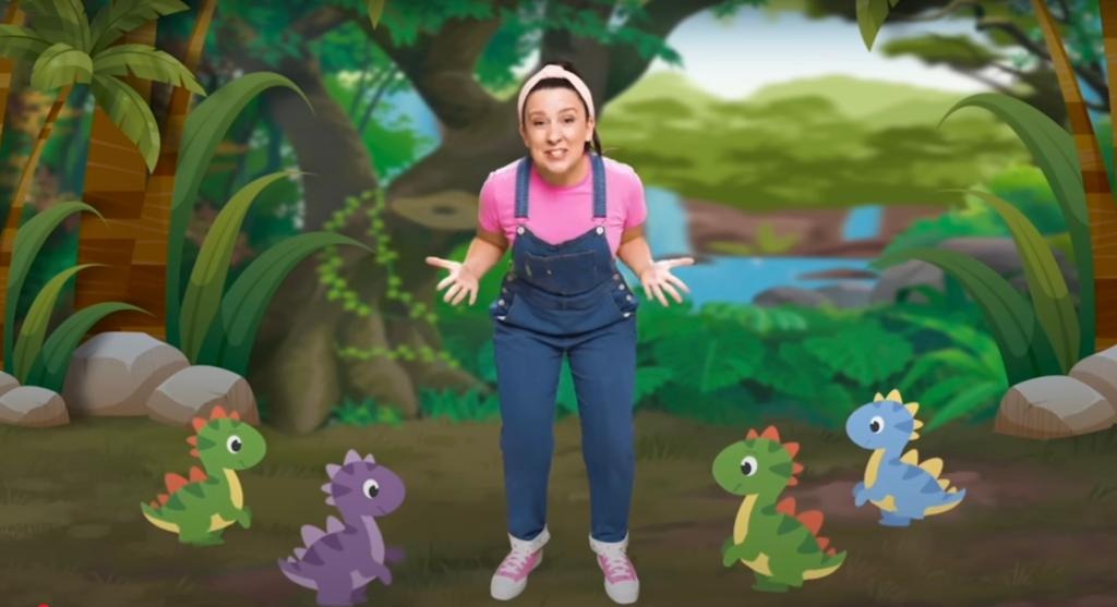 Illustration of Ms. Rachel in a jungle scene with four cartoon dinosaurs.