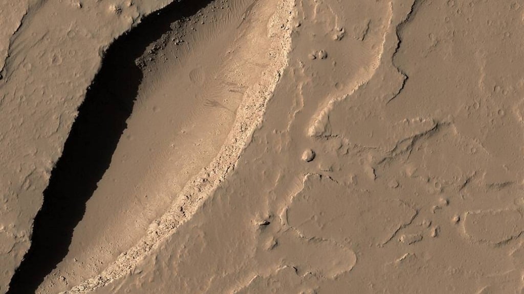 Lava Is Believed To Have Flowed From This Large Volcanic Vent In The Tharsis Region On Mars