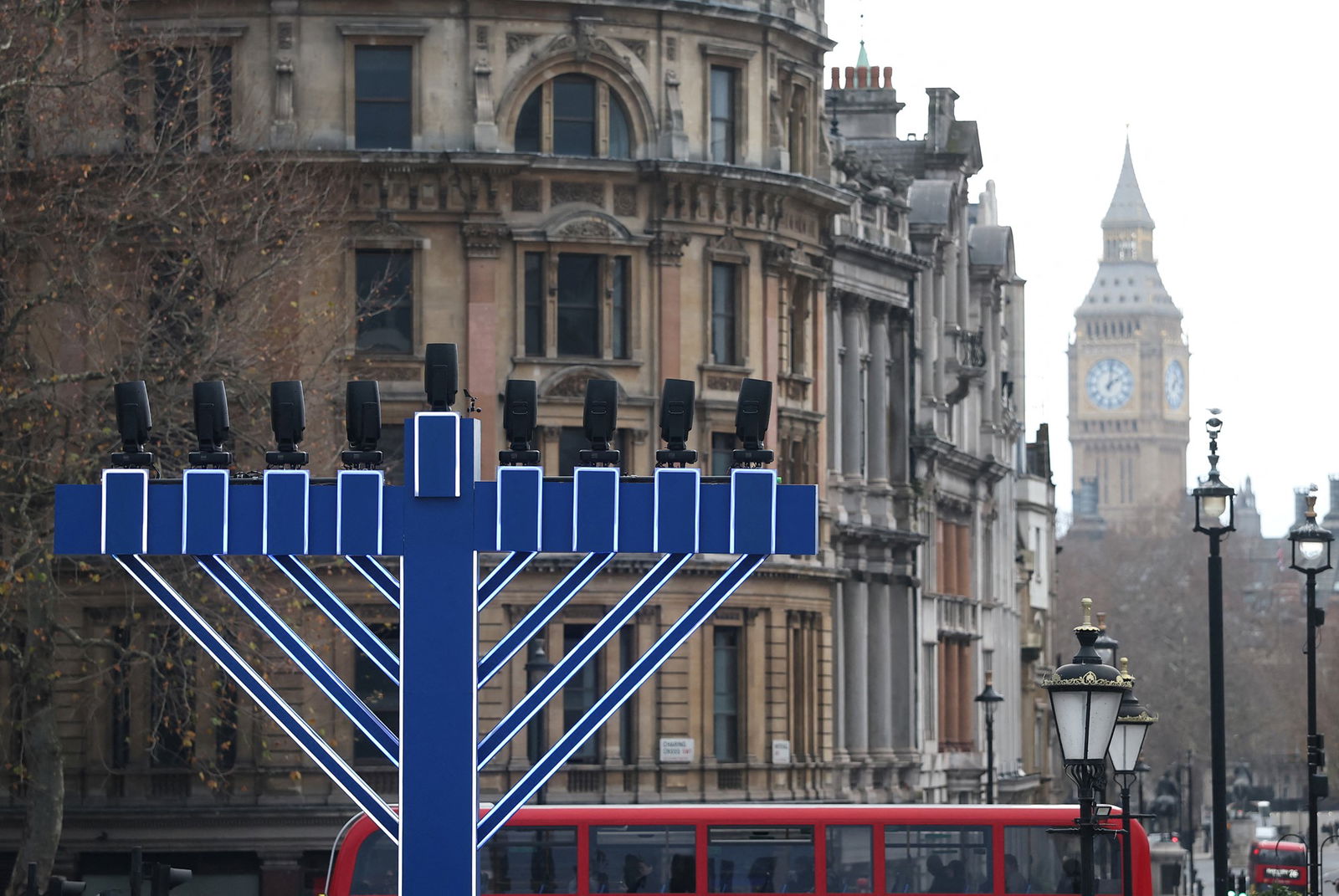 A large menorah erected in the view of the big ben clock