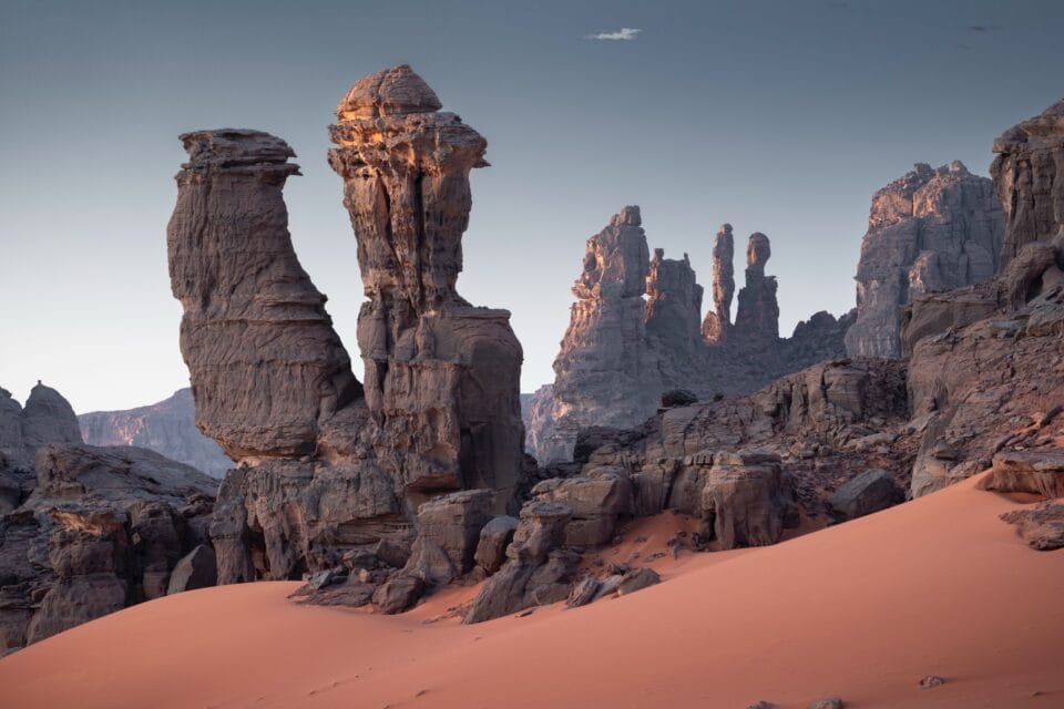 A photograph by Henriqu Murta of otherworldly rock formations in the desert in Algeria