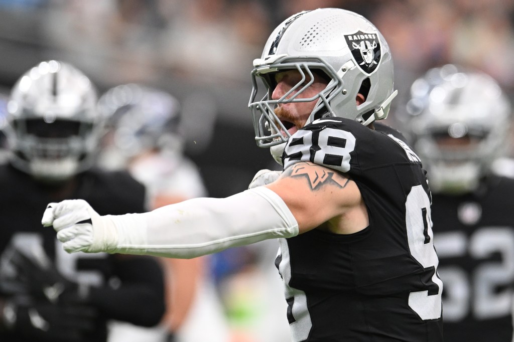 Las Vegas Raiders player Maxx Crosby #98 celebrating after a sack.