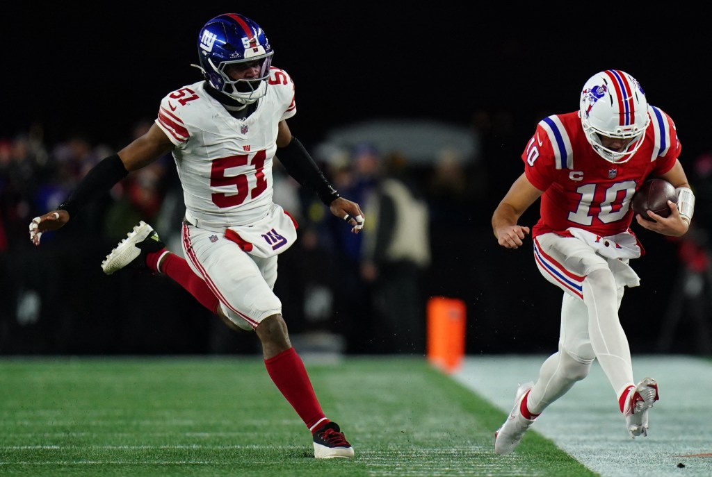 New England Patriots quarterback Drake Maye (10) running the ball against New York Giants linebacker Abdul Carter (51).