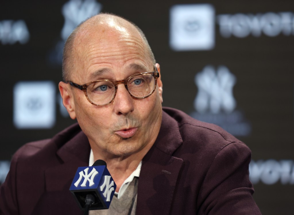 New York Yankees GM Brian Cashman speaking to the media at a press conference.