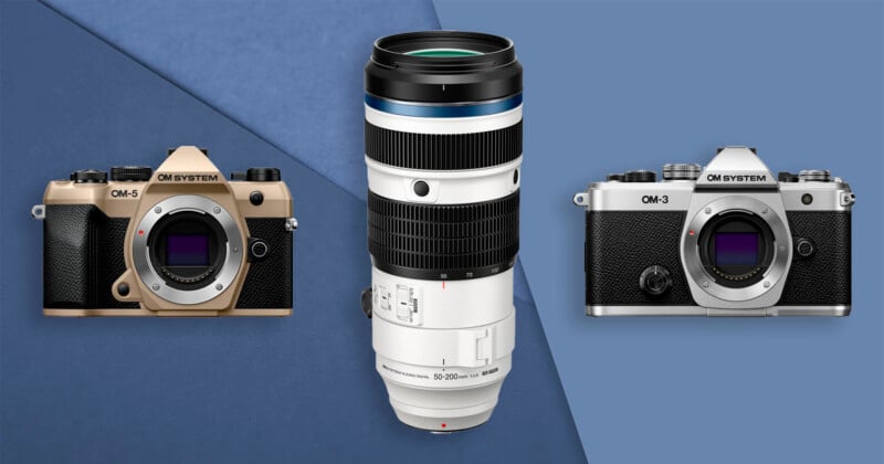 Two OM System OM-5 cameras, one gold and one silver, are positioned on either side of a large white OM System 150-600mm lens, against a blue geometric background.