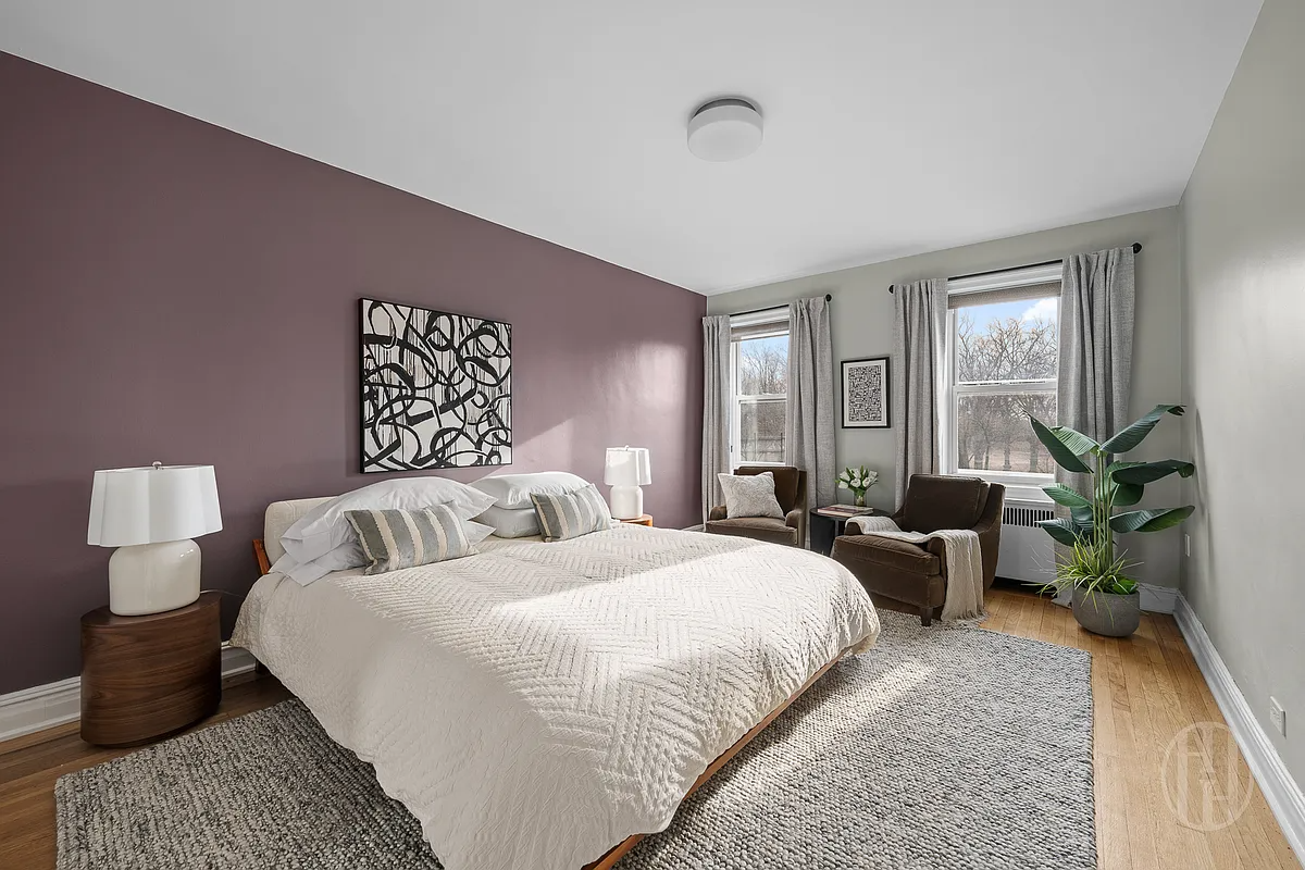 bedroom with one wall painted purple