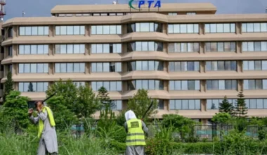 people work near the pakistan telecommunication authority pta headquarters building in islamabad on august 16 2024 photo afp