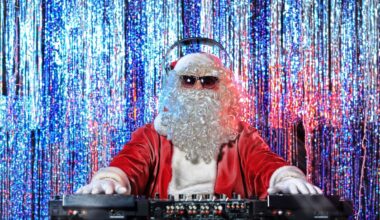 DJ Santa Claus mixing up some Christmas cheer. Disco lights in the background.