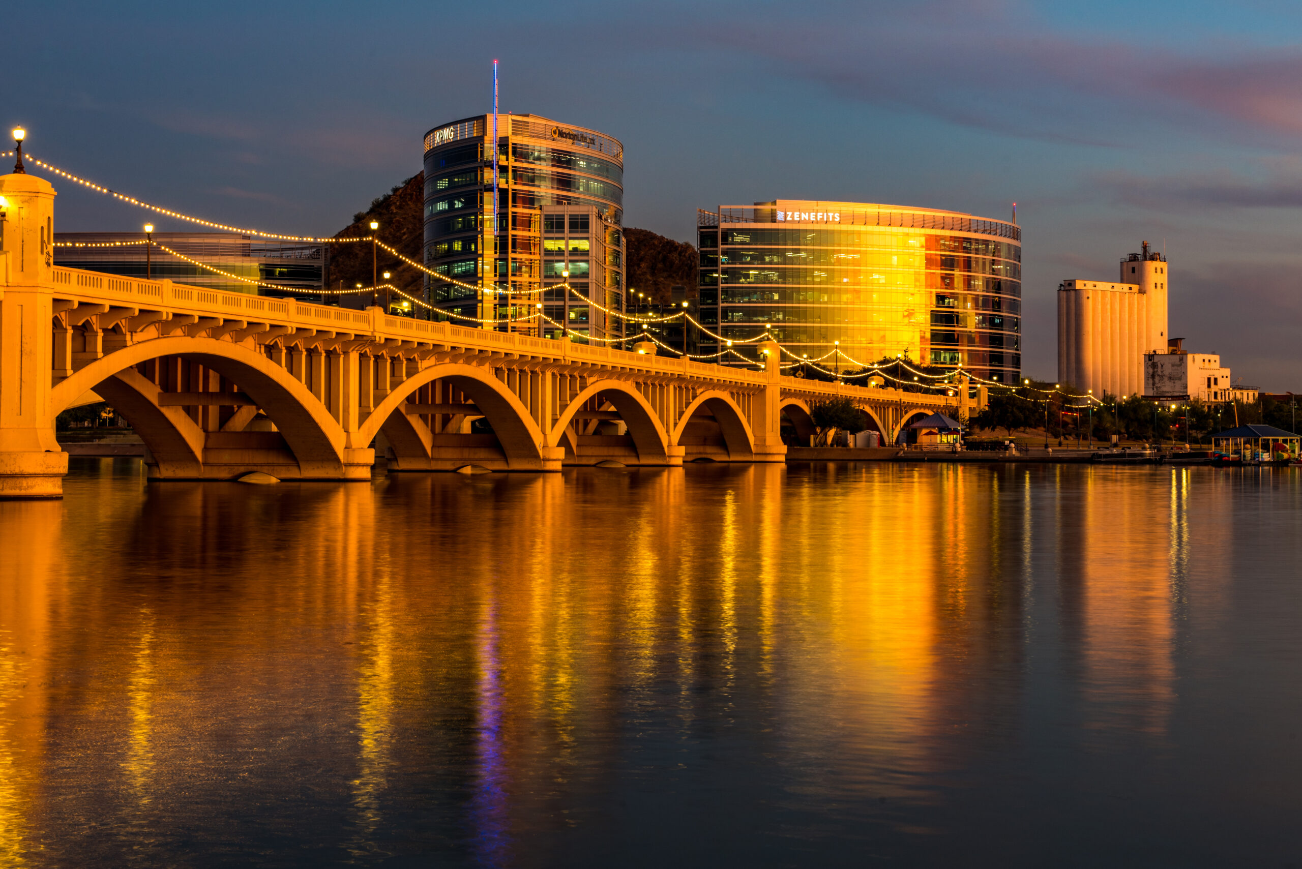 Downtown tempe lit by the sunset behind tempe town lake