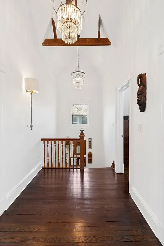 top floor with vaulted ceiling, wood floor