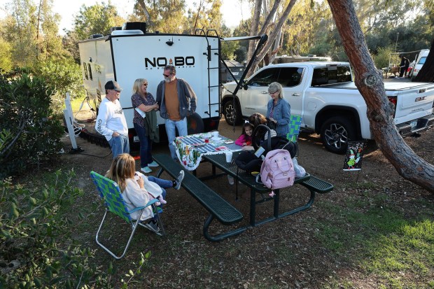 The Arnold-Wronka-Lowe clan gathered at Guajome Regional Park to camp Tuesday afternoon on Dec. 16, 2025. (John Gastaldo for the San Diego Union-Tribune)
