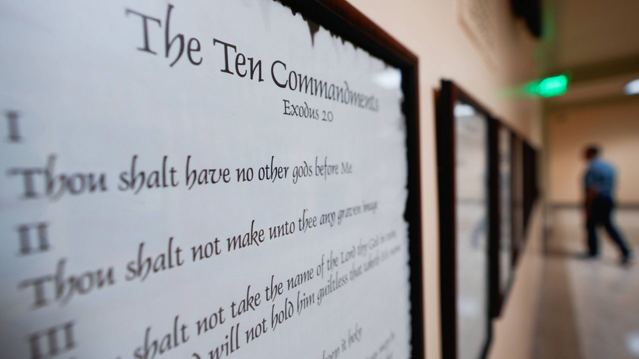 A copy of the Ten Commandments is posted along with other historical documents in a hallway of the Georgia Capitol, June 20, 2024, in Atlanta. (AP Photo/John Bazemore, File)