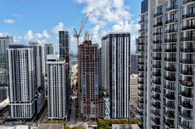 The Okan Tower in Miami, shown under construction on Monday, will stand more than 900 feet tall when it opens in 2027. Crews are now working on the 36th floor. (Amy Beth Bennett/South Florida Sun Sentinel)