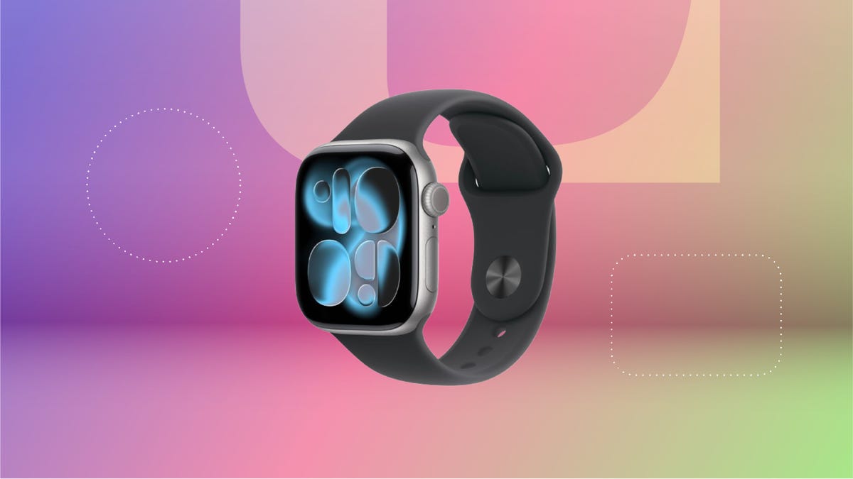 Apple Watch 11 with an aluminum face and black band against purple, pink and green CNET background.