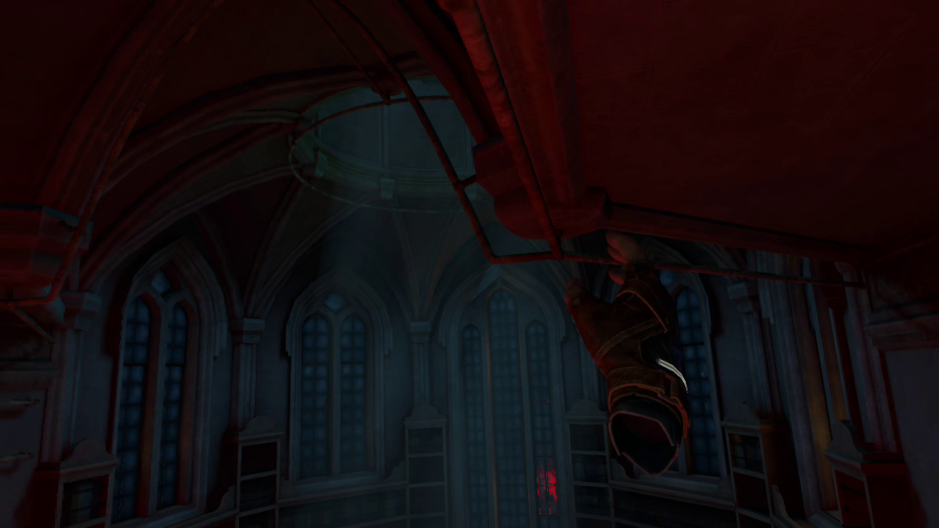 The player's right hand reaches out for an overhead pipe in a private chapel dimly lit by moonlight.