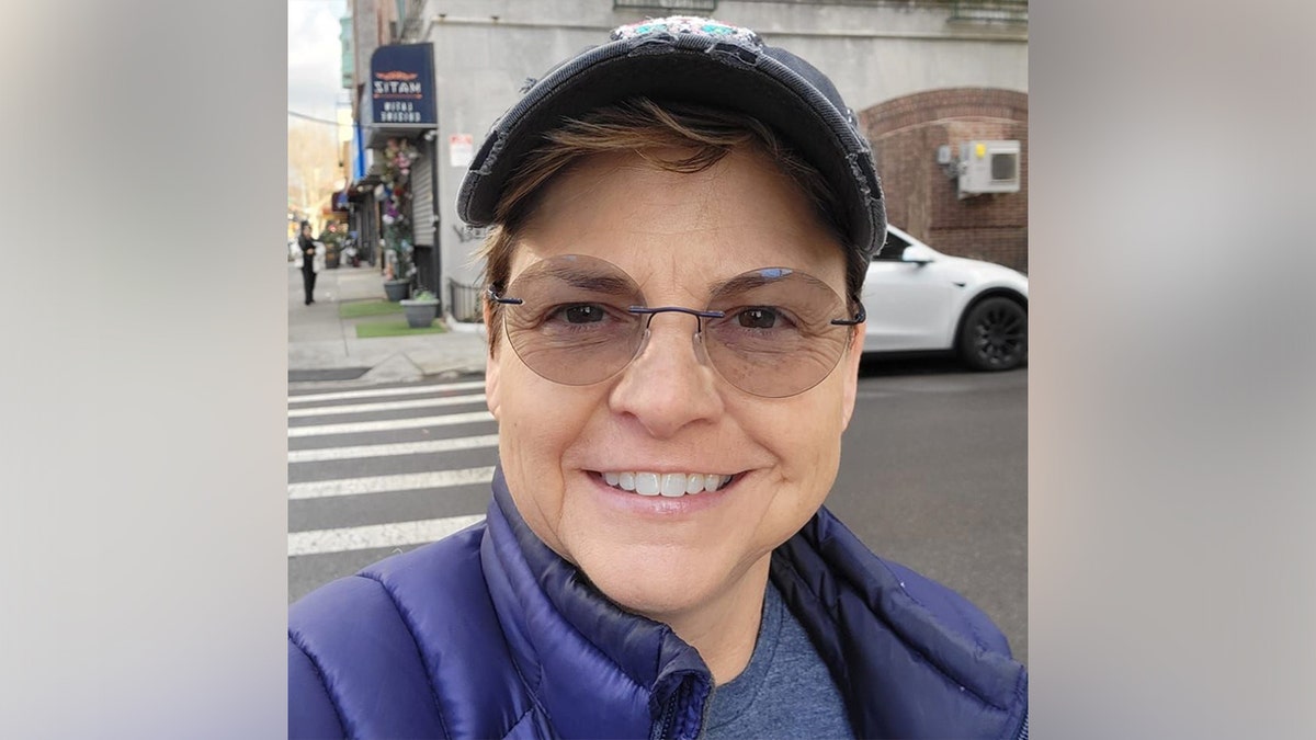 Wenne Alton Davis taking a selfie in the street.