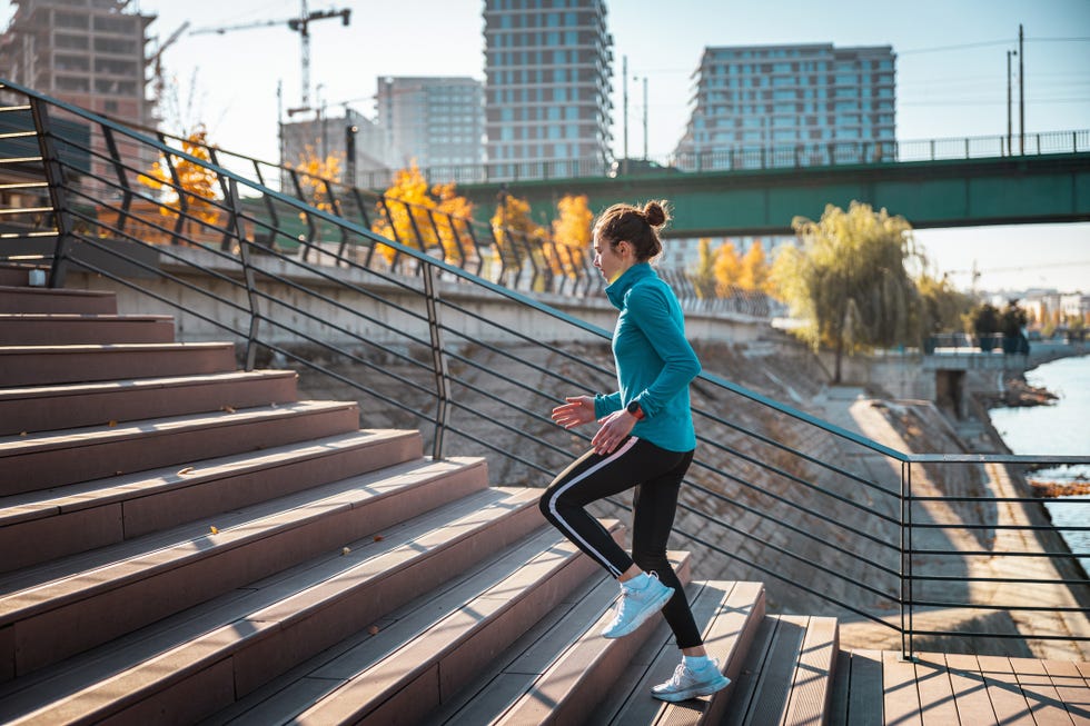 easy fitness resolutions: woman climbing outdoor stairs