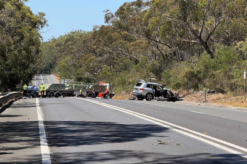 semi trailer cross the road with car crashed into bush