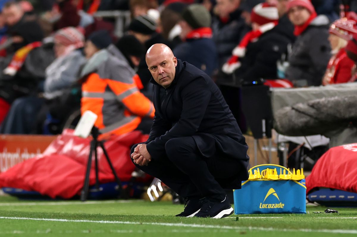 LIVERPOOL, ENGLAND - JANUARY 01: Arne Slot, Manager of Liverpool, crouches as he looks on from the touchline during the Premier League match between Liverpool and Leeds United at Anfield on January 01, 2026 in Liverpool, England. (Photo by Carl Recine/Getty Images)