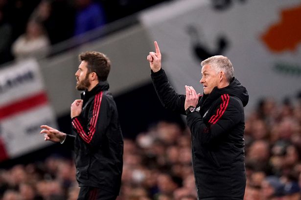 Ole Gunnar Solskjaer and Michael Carrick gesture. 