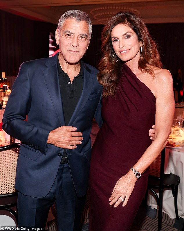 Once inside the event, she cozied up to Oscar-winner George Clooney, who co-founded Casamigos tequila with Crawford's longtime husband Rande Gerber
