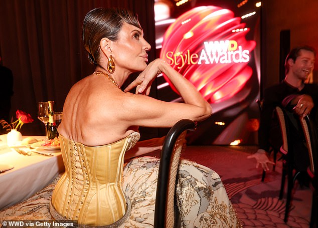 Lisa Rinna also attended the star-studded function in a daring gold corset