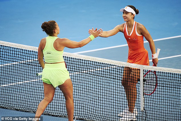 Jovic shakes hands with Paolini at the net at the end of their Australian Open battle on Friday