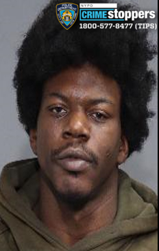 Mugshot of Germaine Parham, a 33-year-old male with dark skin and dark curly hair.