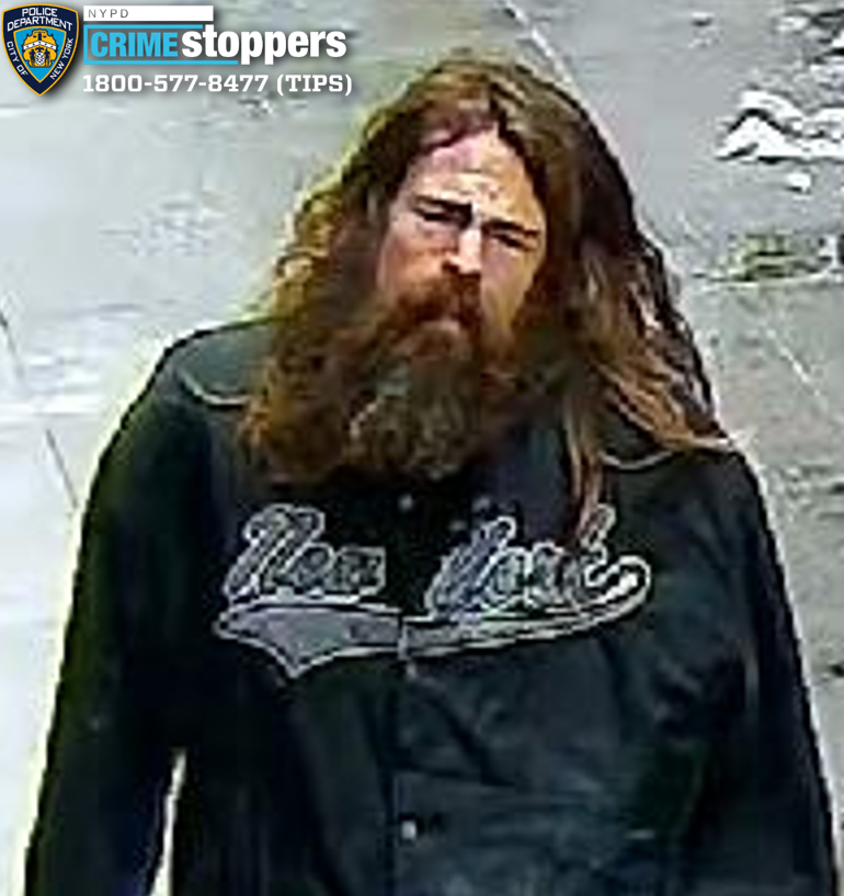 The long-haired, bearded suspect was caught in the act etching the disturbing words on the door of The Grolier Club on East 60th Street near Park Avenue around 12:15 p.m. Dec. 27, police said.
