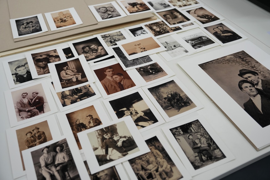 printed out photographs on a table.